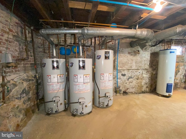 utility room featuring water heater and gas water heater