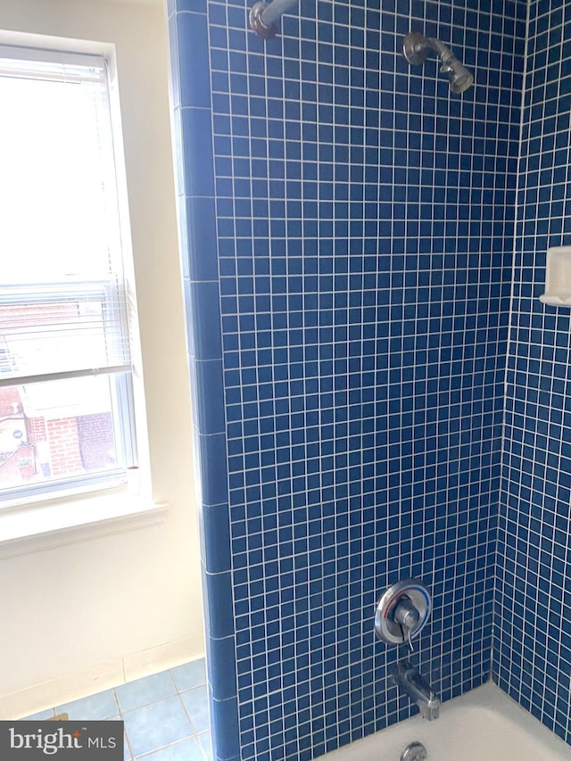 bathroom with shower / bathing tub combination and tile patterned floors