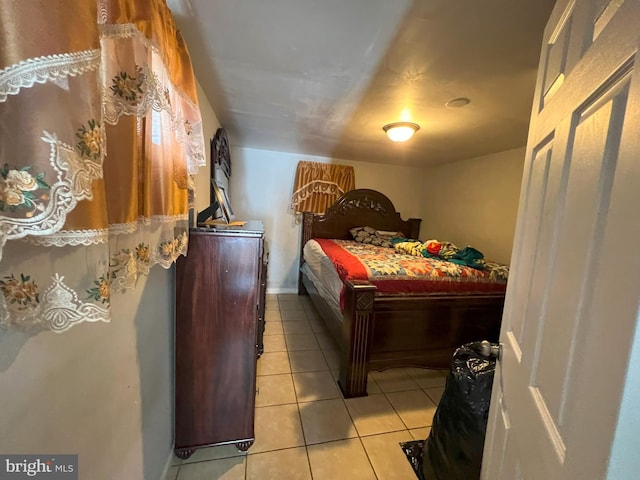 bedroom with light tile patterned floors