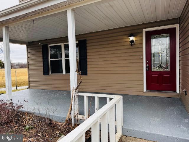 property entrance featuring covered porch