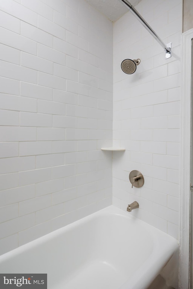 bathroom featuring washtub / shower combination