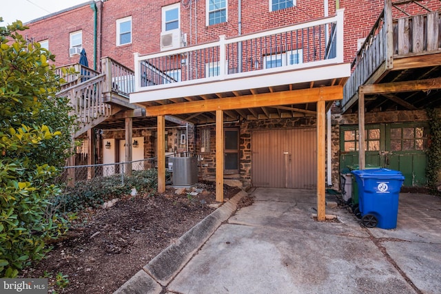 view of patio with central AC and concrete driveway