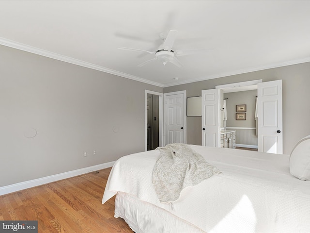 bedroom featuring ceiling fan, light wood-style floors, baseboards, and ornamental molding