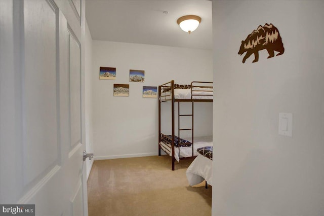 carpeted bedroom with baseboards