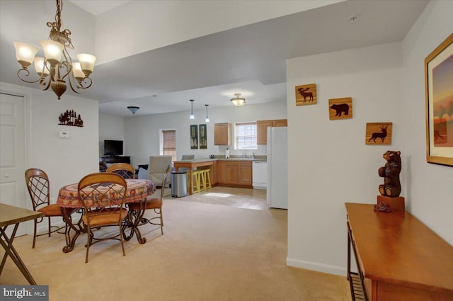 dining area with light carpet, baseboards, and a notable chandelier