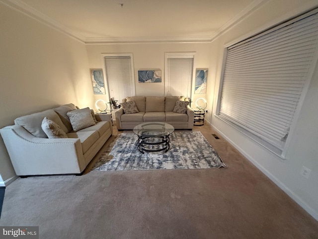 carpeted living room featuring ornamental molding, visible vents, and baseboards