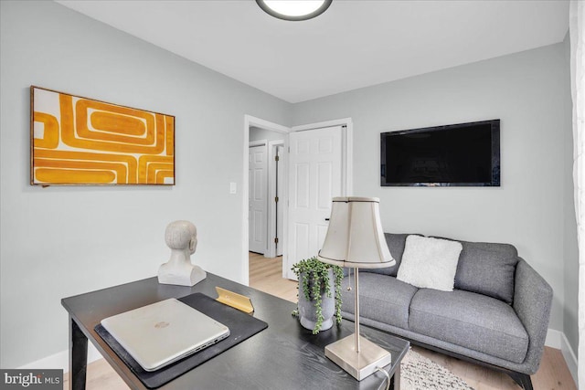 home office with wood finished floors