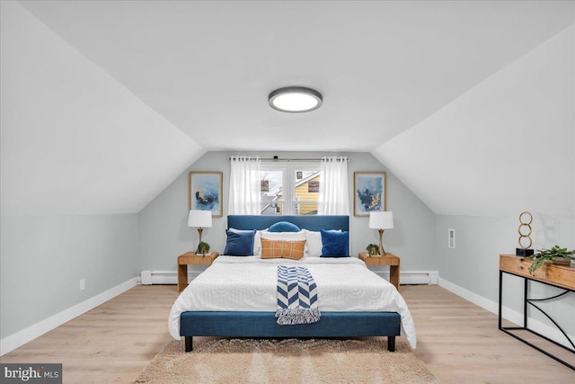 bedroom featuring baseboards, lofted ceiling, a baseboard radiator, wood finished floors, and a baseboard heating unit