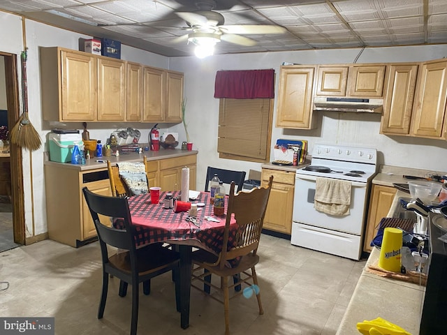 kitchen with light countertops, light brown cabinets, under cabinet range hood, and white range with electric cooktop