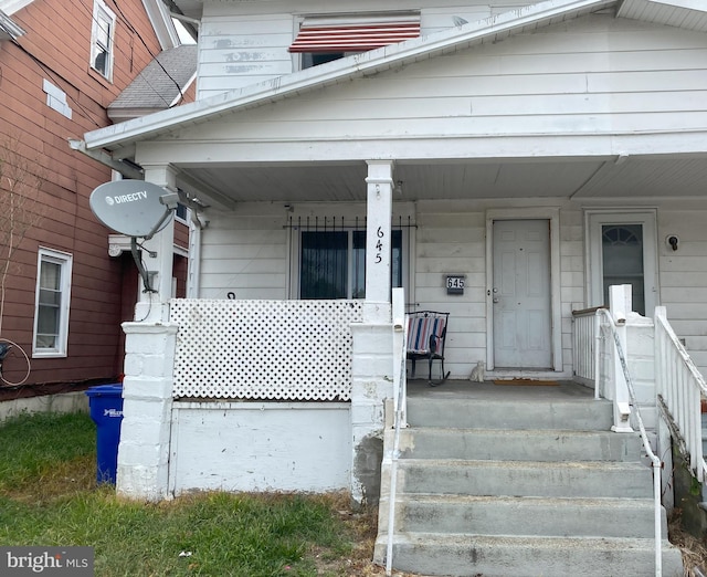 doorway to property featuring a porch