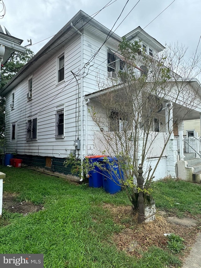 view of property exterior with a yard