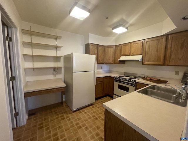 kitchen featuring white appliances, a sink, light countertops, range hood, and open shelves