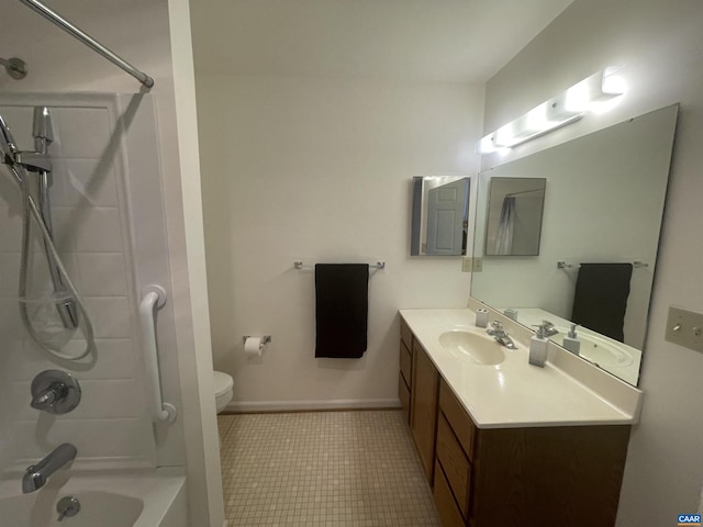 full bathroom featuring toilet, vanity, baseboards, and bathing tub / shower combination