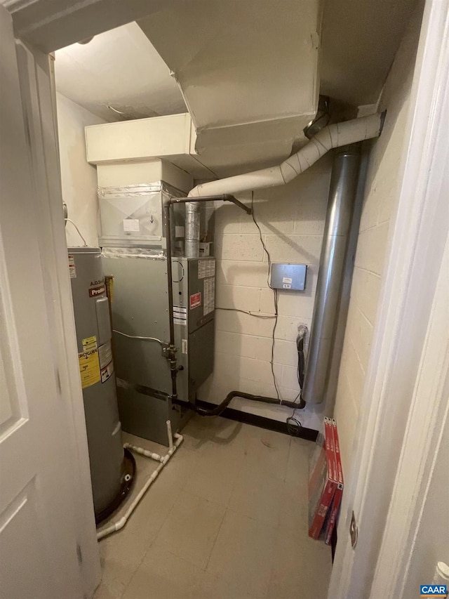 utility room featuring water heater