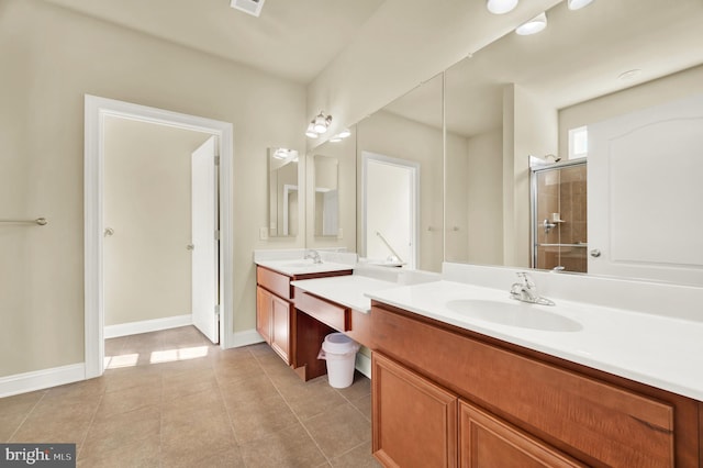 full bathroom featuring a stall shower, baseboards, visible vents, tile patterned floors, and vanity