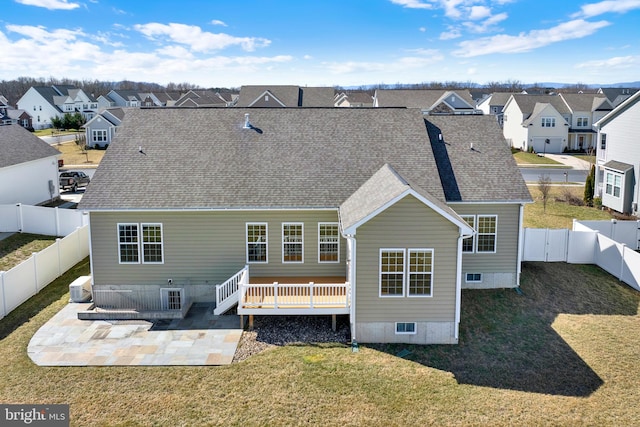 back of house with a patio, a fenced backyard, central air condition unit, a lawn, and a residential view