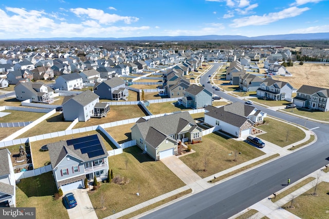 birds eye view of property with a residential view and a mountain view