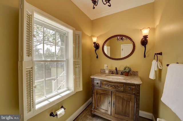 bathroom with baseboards, ornamental molding, tile patterned floors, and vanity