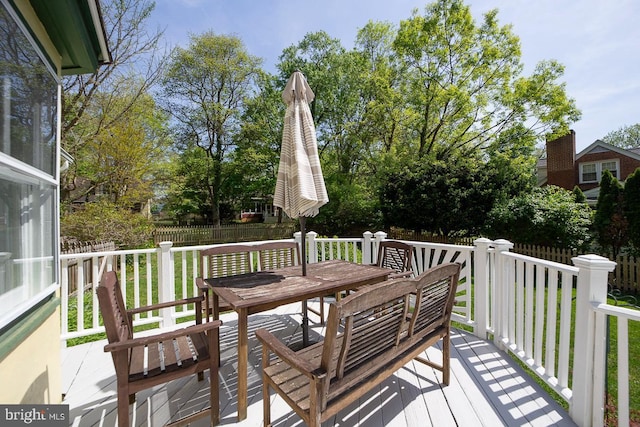 deck with fence and a lawn