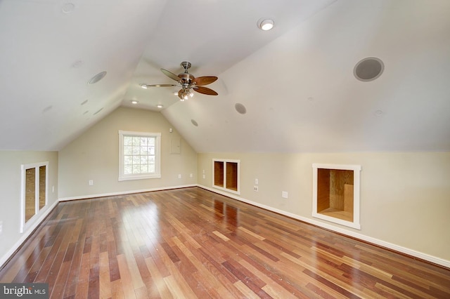 bonus room with baseboards, ceiling fan, lofted ceiling, and hardwood / wood-style flooring