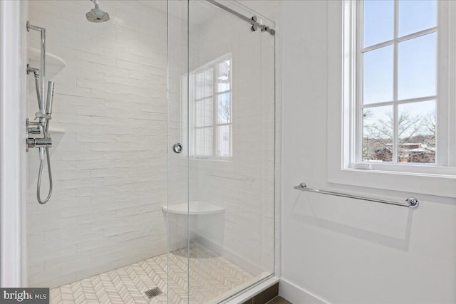 bathroom with a shower stall