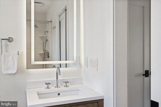 full bathroom with vanity and a shower stall