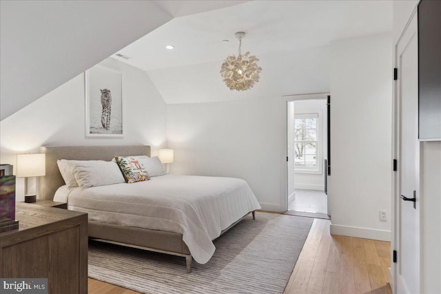 bedroom featuring visible vents, baseboards, light wood finished floors, recessed lighting, and vaulted ceiling