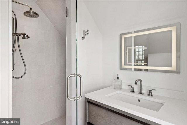 full bathroom with a shower stall and vanity