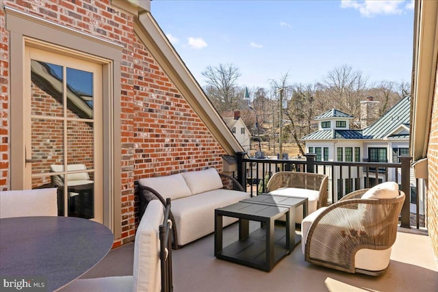 exterior space featuring outdoor dining space, an outdoor living space, and a balcony