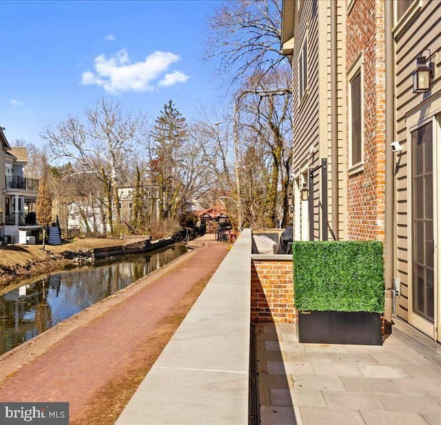 view of property's community with a water view