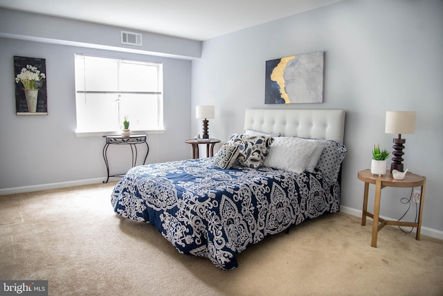 bedroom featuring carpet, visible vents, and baseboards