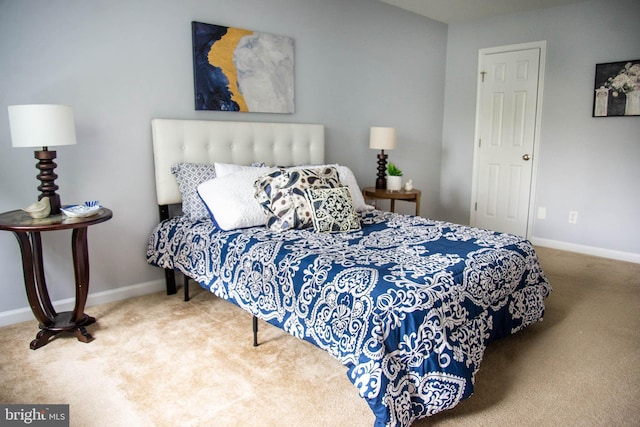 bedroom featuring baseboards and carpet flooring