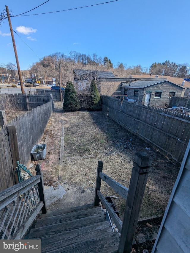 view of yard with a fenced backyard