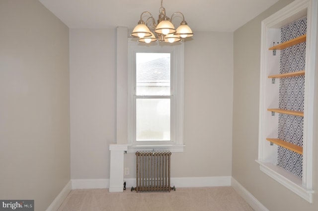 unfurnished dining area with radiator, an inviting chandelier, carpet floors, and a wealth of natural light