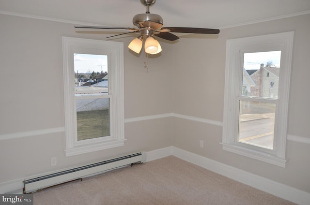 carpeted spare room featuring baseboards, a baseboard radiator, and crown molding