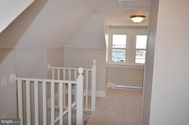 additional living space featuring carpet floors, baseboards, vaulted ceiling, and baseboard heating