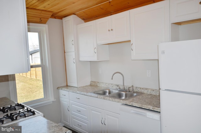 kitchen with white appliances, a sink, wood ceiling, white cabinetry, and light countertops