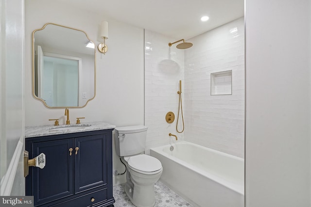 bathroom featuring recessed lighting, shower / bath combination, vanity, and toilet