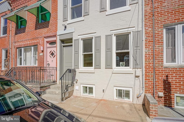 entrance to property with brick siding