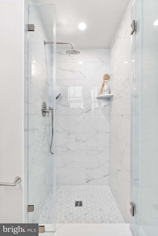 full bath featuring a shower stall