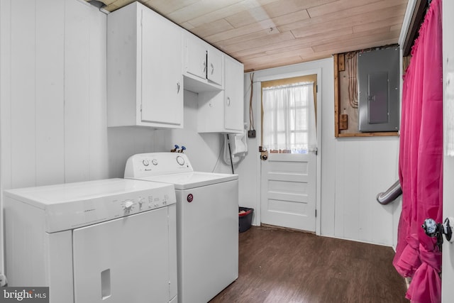 clothes washing area featuring wooden ceiling, washer and dryer, cabinet space, electric panel, and dark wood finished floors