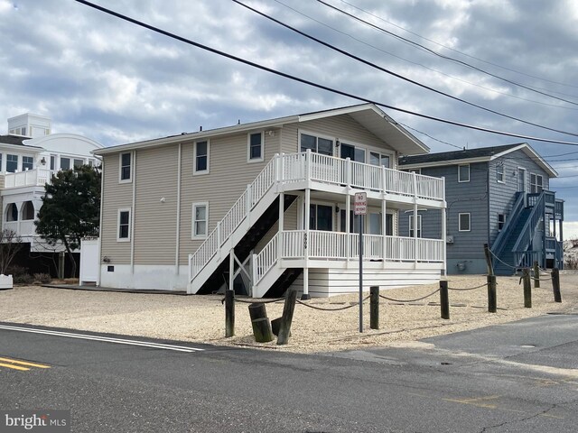 5909 Ocean Blvd, Long Beach Township, NJ 08008 - view of front facade featuring stairway and covered porch