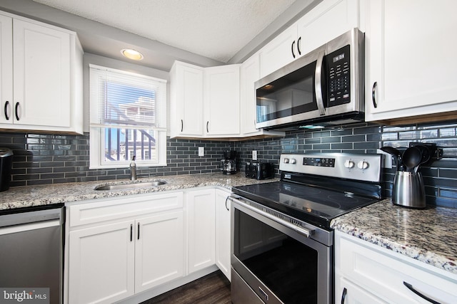 5909 Ocean Blvd, Long Beach Township, NJ 08008 - kitchen featuring white cabinets, appliances with stainless steel finishes, and a sink