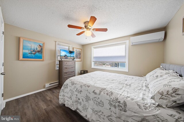 5909 Ocean Blvd, Long Beach Township, NJ 08008 - bedroom featuring baseboards, dark wood finished floors, a wall mounted air conditioner, a textured ceiling, and baseboard heating