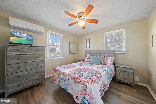 5909 Ocean Blvd, Long Beach Township, NJ 08008 - bedroom with an AC wall unit, wood finished floors, and baseboards
