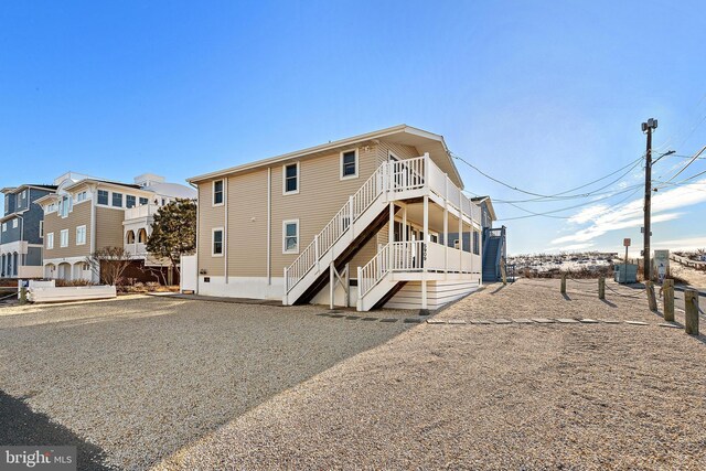 5909 Ocean Blvd, Long Beach Township, NJ 08008 - rear view of house featuring stairway