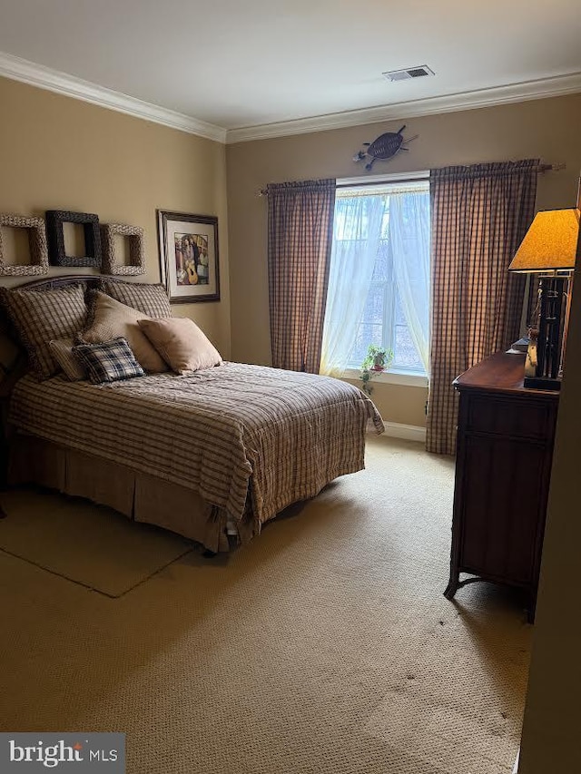 bedroom with light carpet, visible vents, and ornamental molding