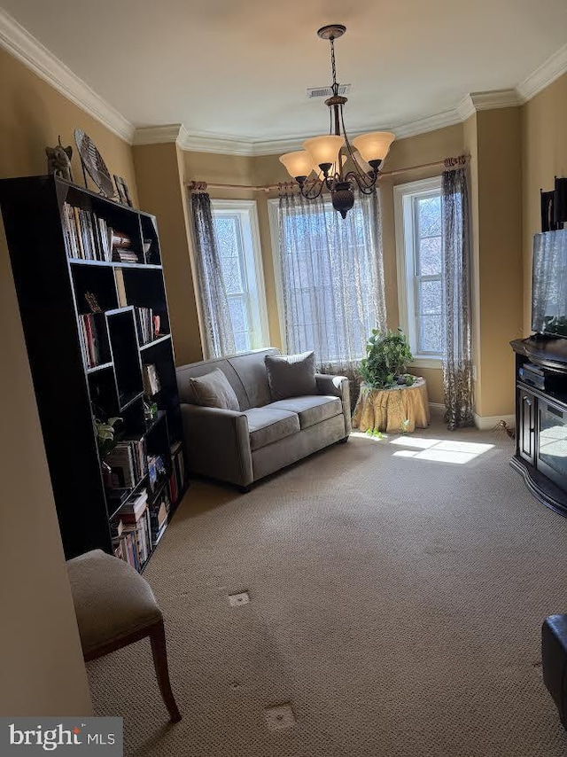 living area with ornamental molding, carpet, visible vents, and a notable chandelier