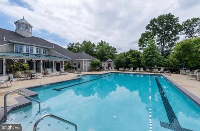 community pool featuring a patio