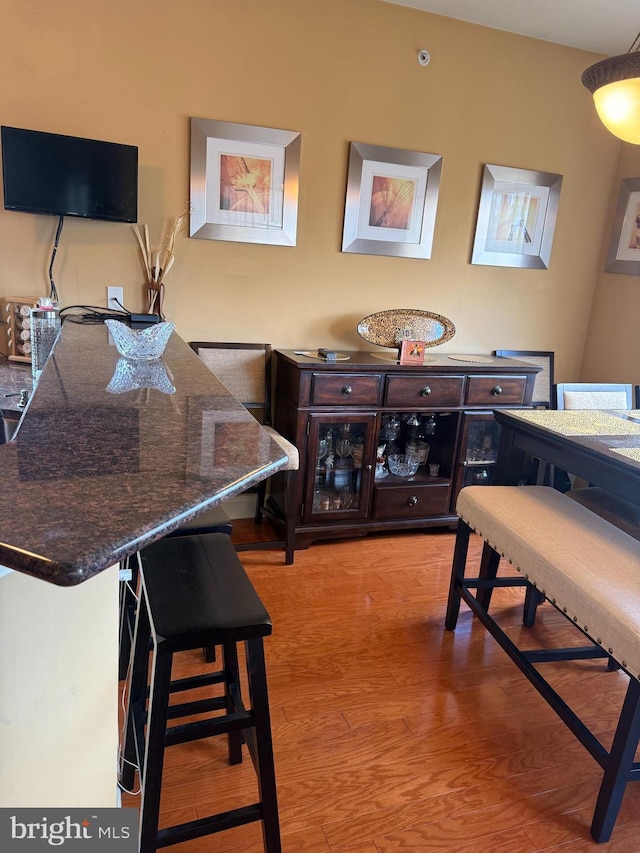 dining area with wood finished floors